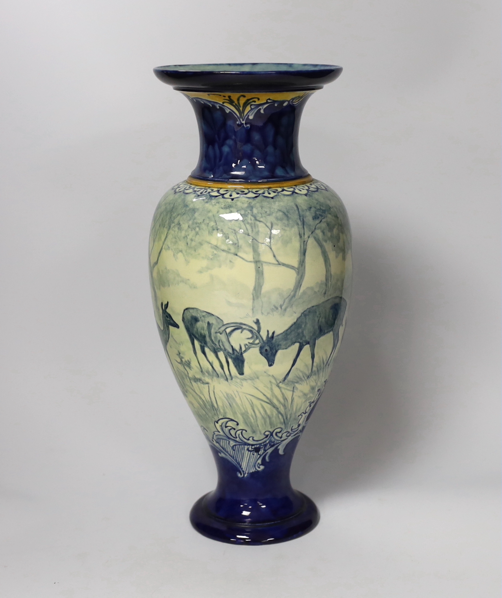 A Doulton Lambeth faience vase, c.1900, attributed to Hannah Barlow, painted with deer in woodland, monogram to the body, and to the base ‘KBS’ for Katherine B. Smallfield, 35cm, high, cf. Bonhams, Knightsbridge, London,